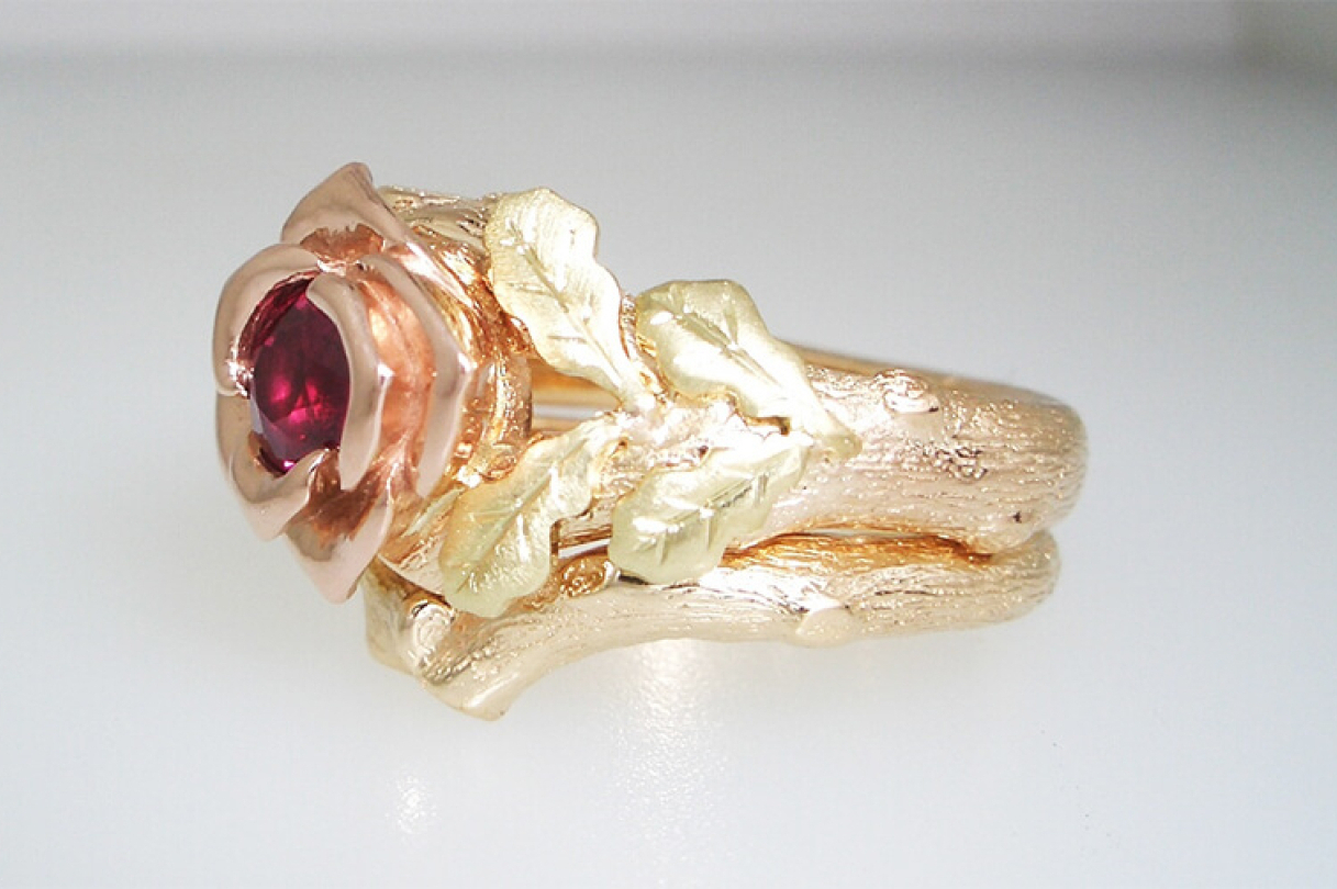 Gold rose petal ring with red gem